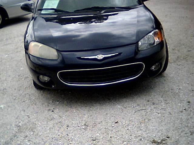 front of car with one clean headlight and one foggy