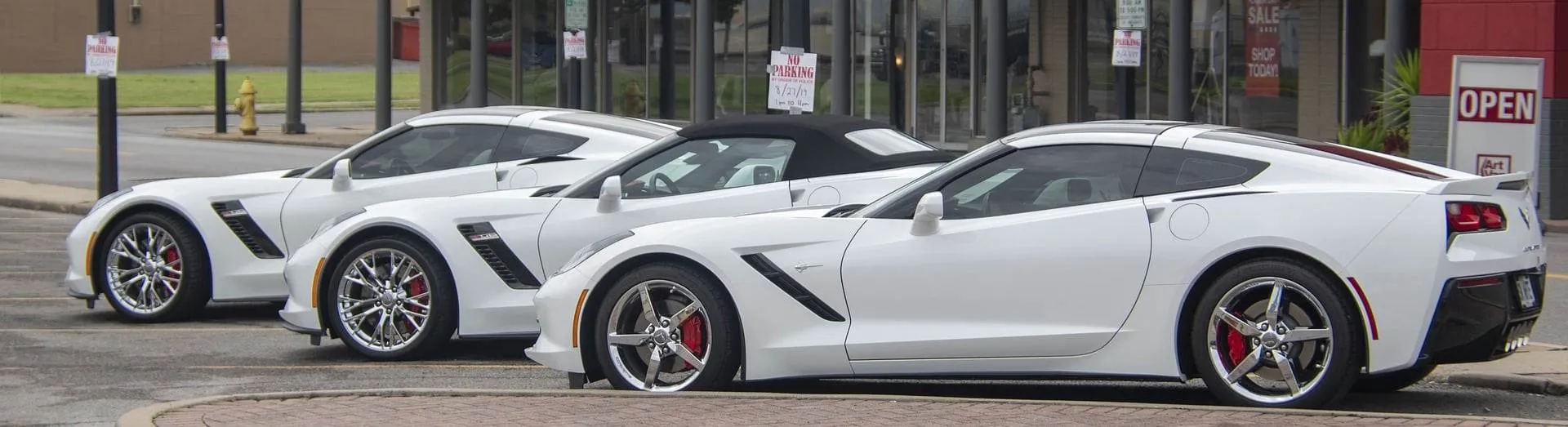 Row of new white Chevy Corvettes
