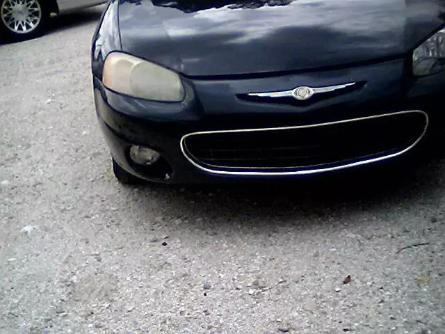 front of car with foggy headlight