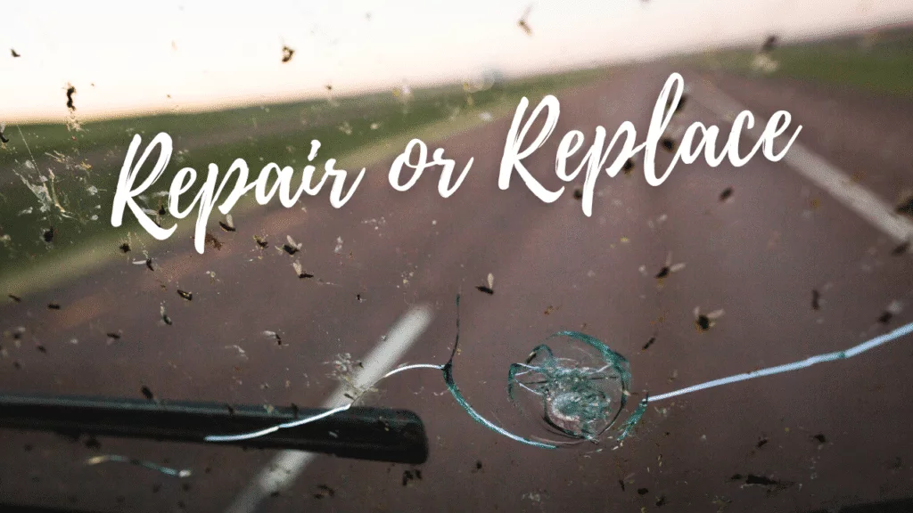 Closeup of a chip in the windshield with long cracks and text showing Repair or Replace.